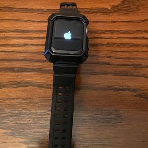 Apple Watch Series 5 with band and charger.
